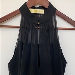 A black silk blouse by Ramy Brook